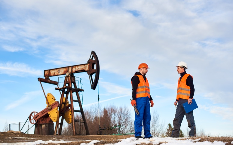 workers at oil derrick