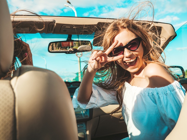 Girls driving in a convertable
