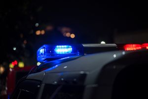 police car at night with lights on