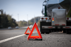 hazard sign by a semi-truck