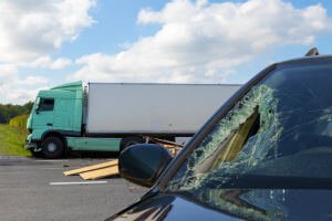 car damaged by truck