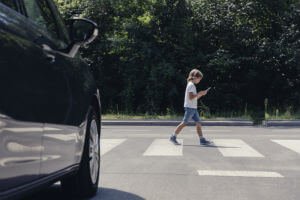 child walking on pedestrian crossing