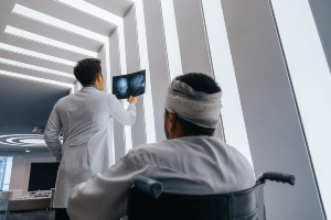 dr and patient looking at xray