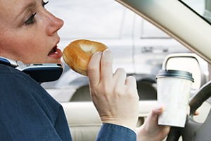 driver eating a bagel