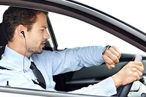 driver looking at wrist watch
