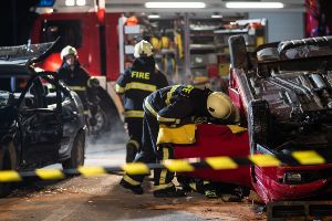 firefighters assisting crash victims