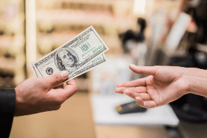 handing over cash