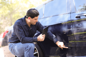 inspecting vehicle damage