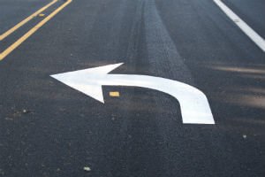 left turn sign on road