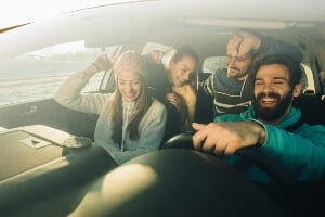 rowdy passengers in a car