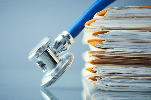 stethoscope on medical records