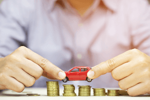 toy car stacked on coins
