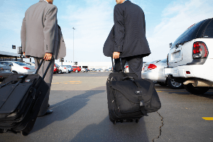 travelers in rental car lot
