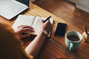 writing in a notebook