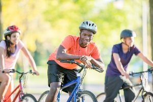 teens riding bicycles in warm weather