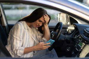 female driver upset at text messages