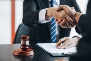 attorney shaking hands with client