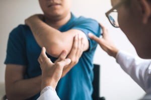 examining shoulder injury