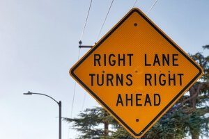 Close-up of right sign to alert drivers of an upcoming right lane turn